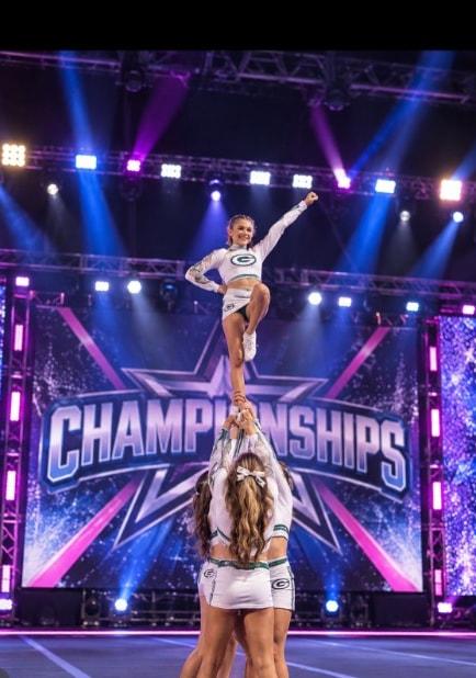 Allstar flyer held in a liberty stunt on a championship stage