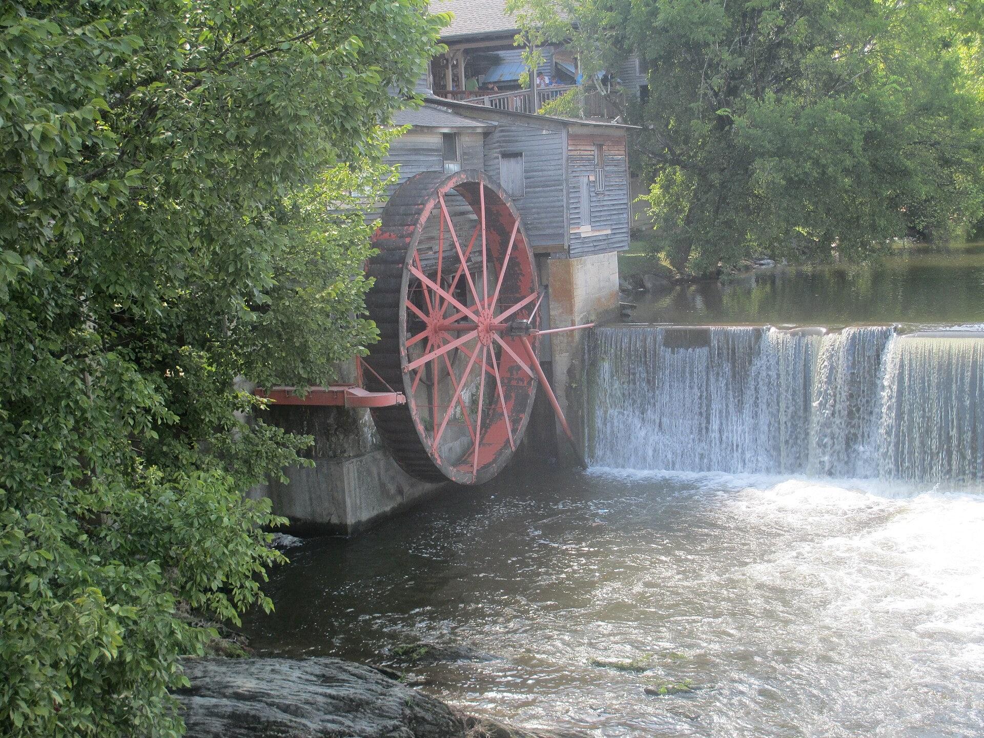 Red water wheel and dam at The Old Mill in Pigeon Forge